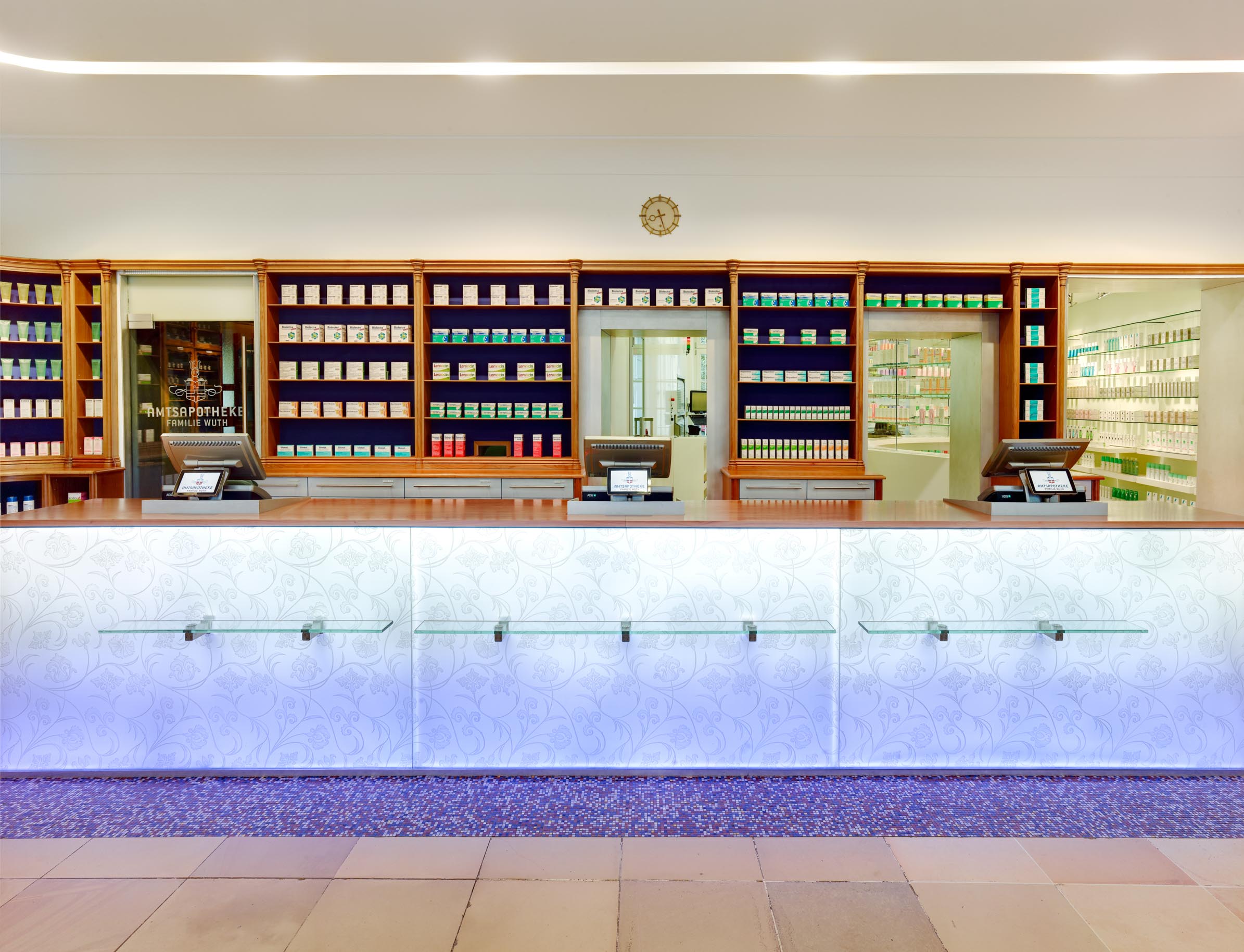 Dispensary with prescription counter and passage to the extended sales area