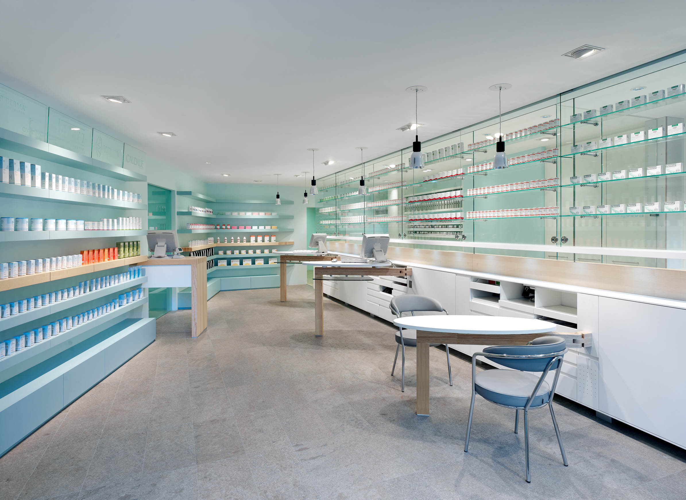 Dispensary with self-service area, glazed medicine display and individual consultation tables