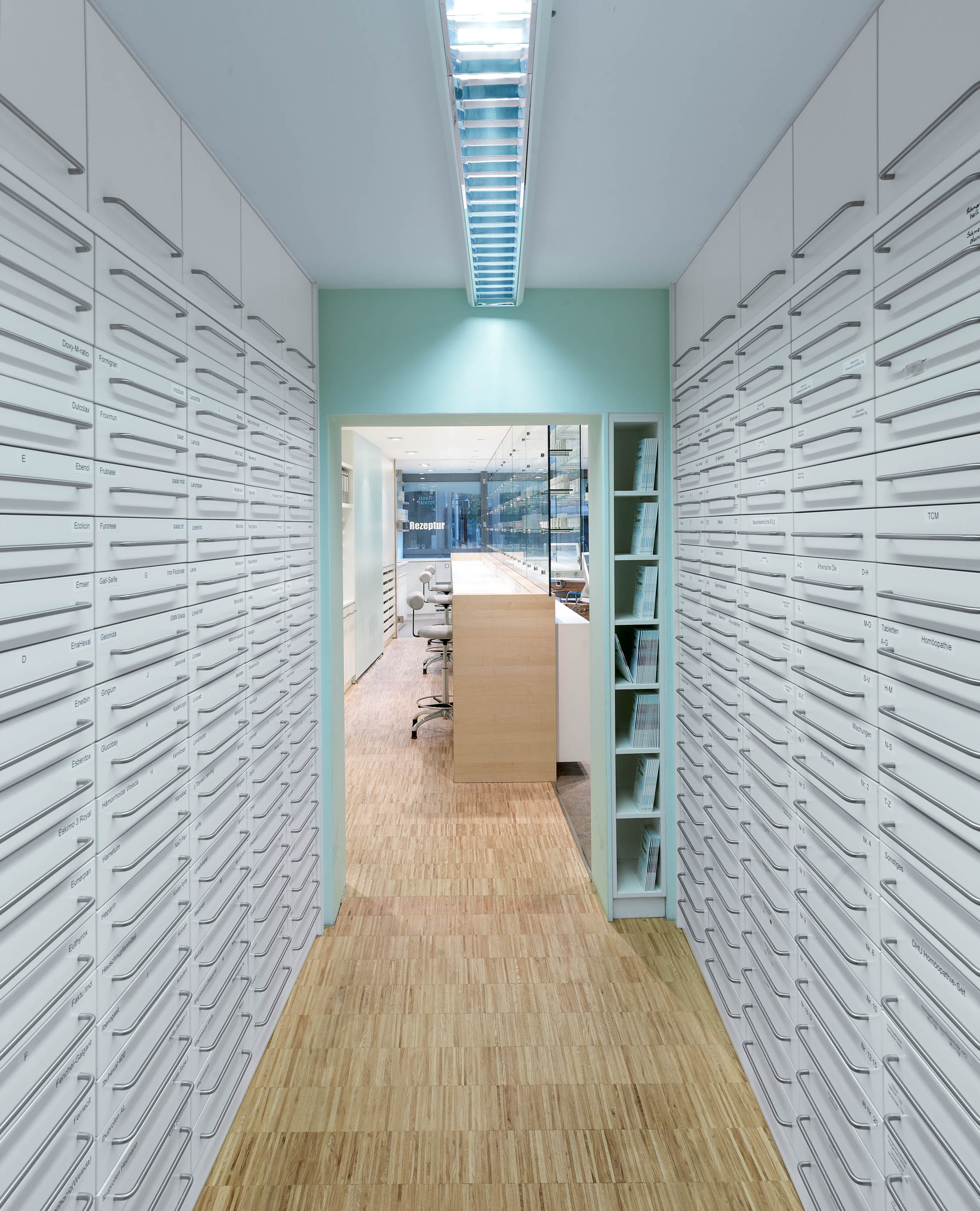 Passage with drawer columns between dispensary and working area