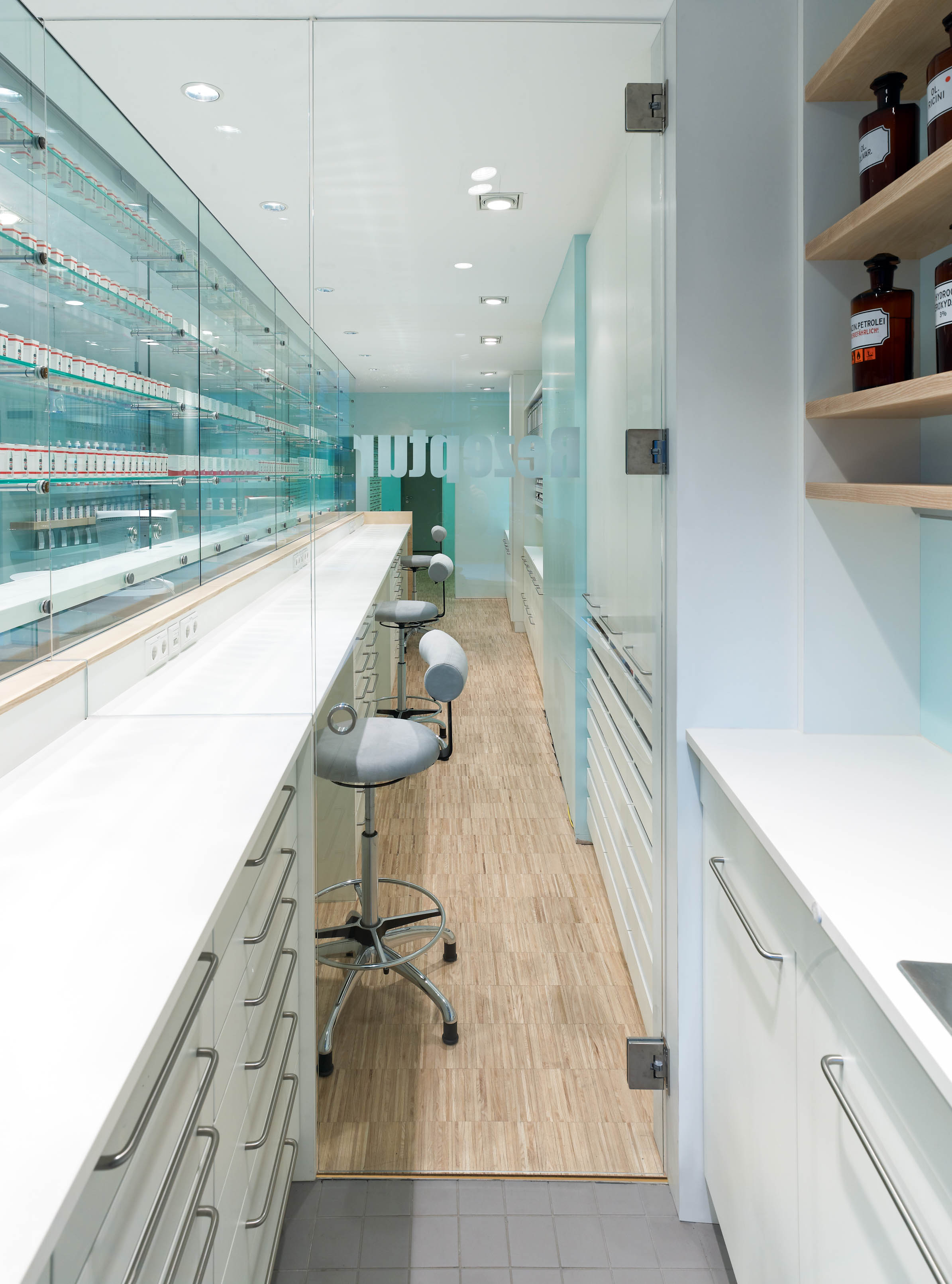Compounding laboratory and workstations behind the transparent medicine display