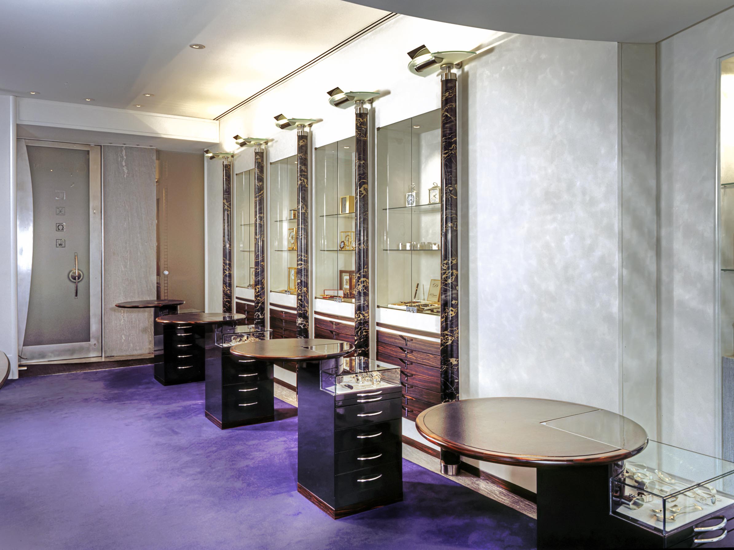 Sales area with consultation desks, natural stone columns and palisander